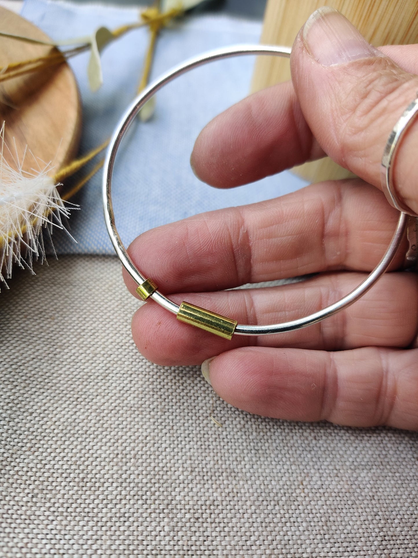 Silver and brass spinner bangle