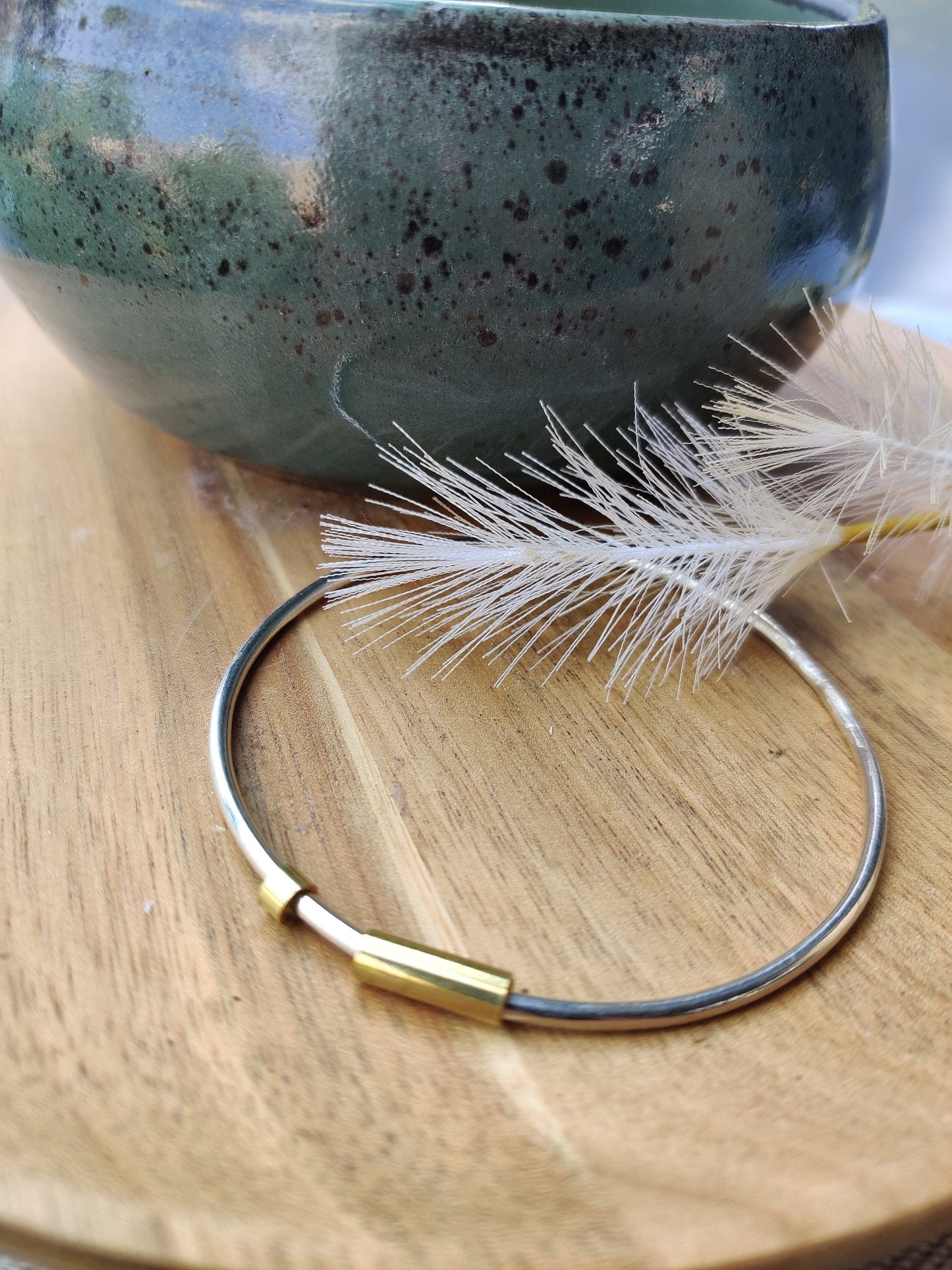 Silver and brass spinner bangle
