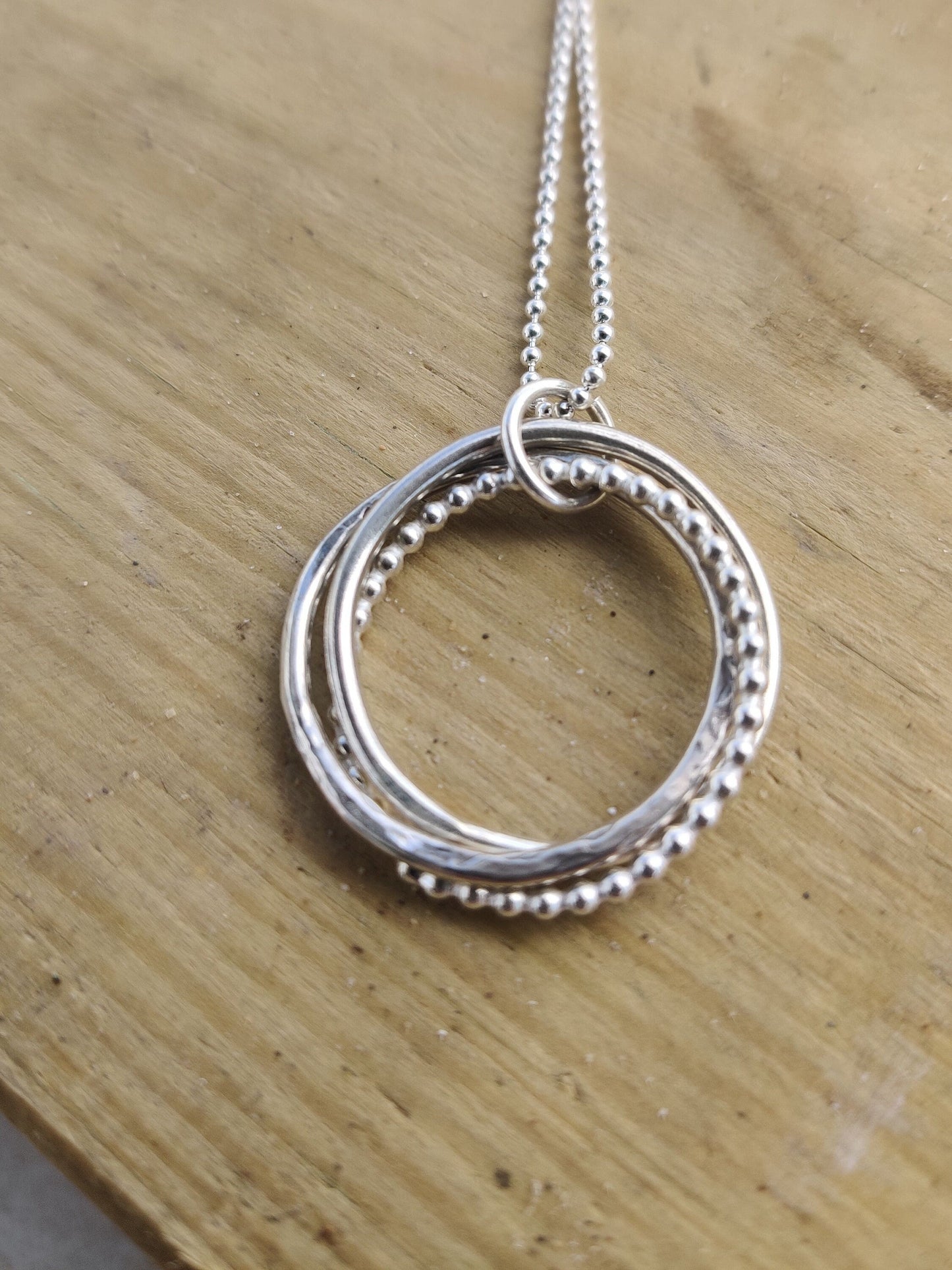 Twisted hoops pendant, silver