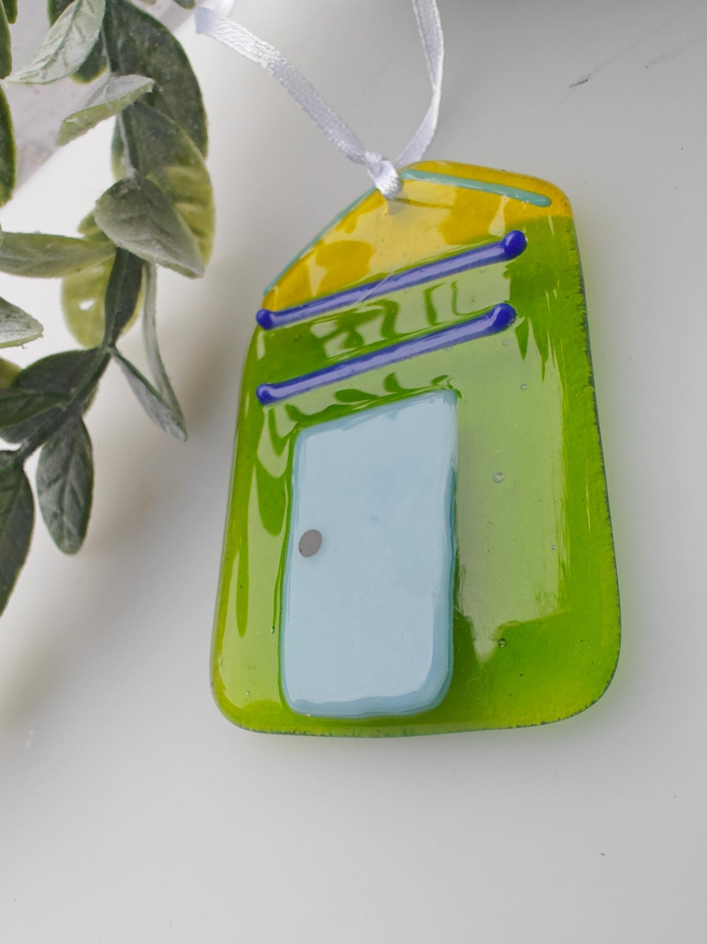 Green and yellow glass, beach hut