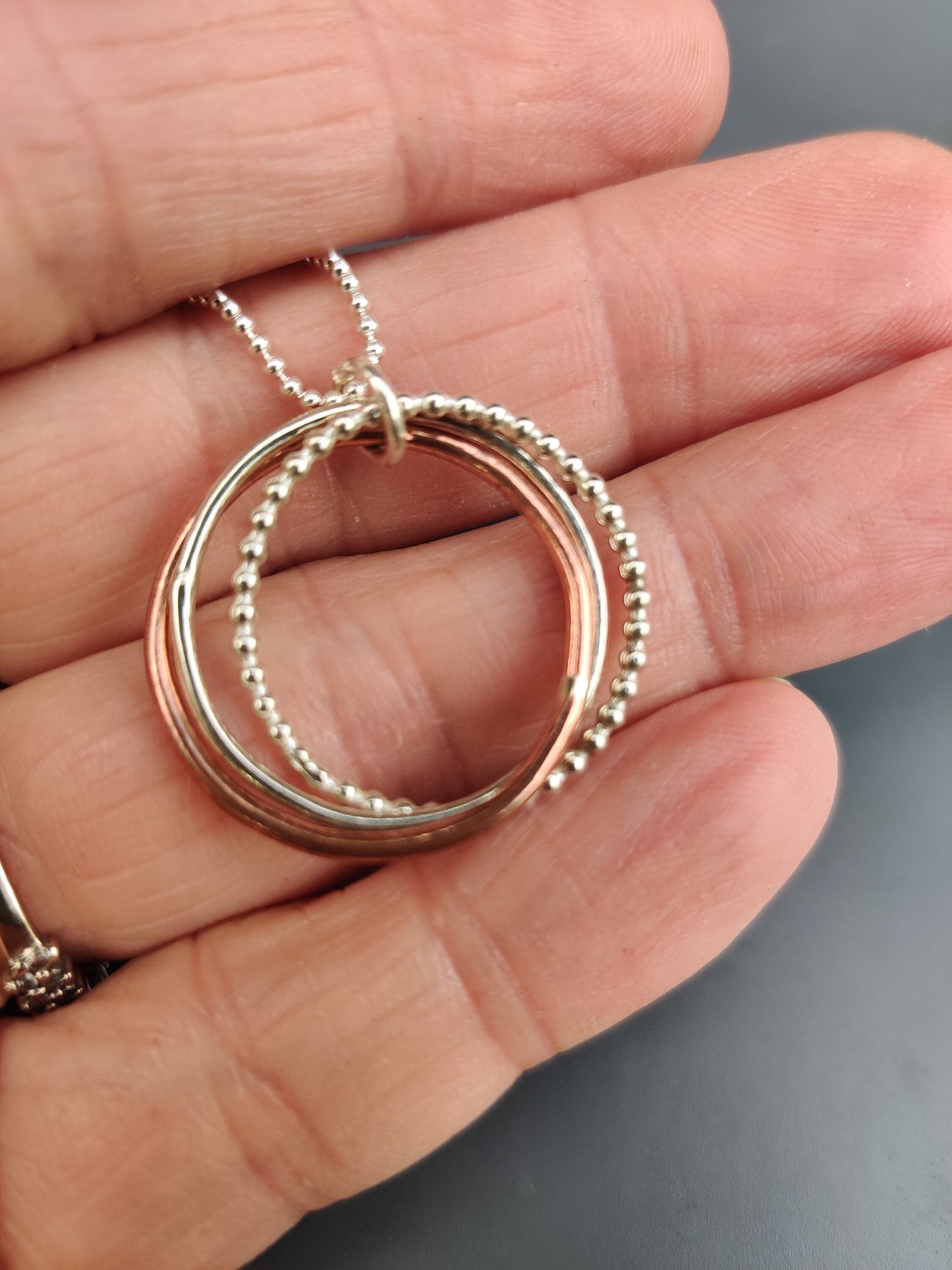 Twisted hoops pendant, silver and copper
