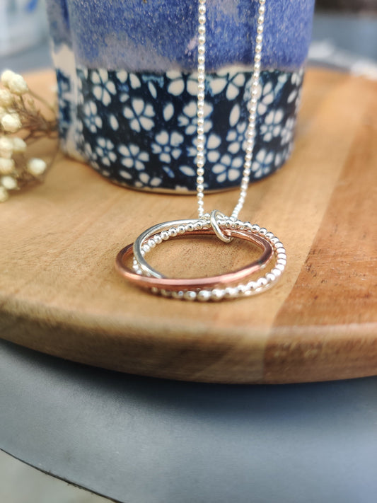 Twisted hoops pendant, silver and copper